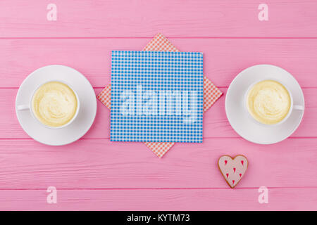 Two cups of cappuccino or latte decorated with foam on marble table  background in Coffee shop. Morning coffee for couple in love. Top view. Two  white mugs of coffee. 12877073 Stock Photo