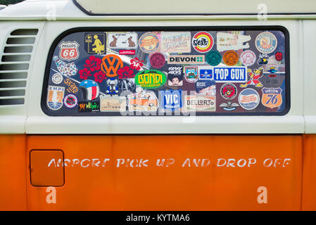 Orange VW Volkswagen camper van abstract with stickers in the window. UK Stock Photo