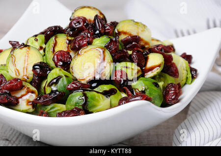 Salad from Brussels sprouts with dried cranberries under balsamic sauce Stock Photo