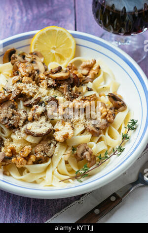 Tagliatelle pasta with a mushroom walnut Sauce Stock Photo