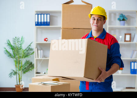 Young man working in relocation services with boxes Stock Photo