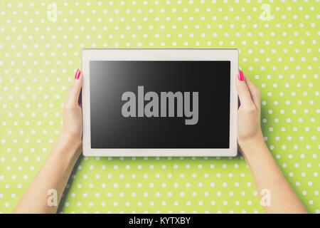 Woman holding white digital tablet. Close up Stock Photo