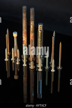 Upturned screws in pattern Stock Photo