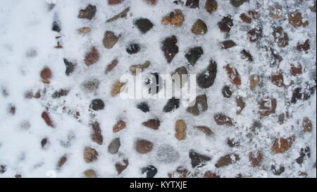 Old cobblestones covered with snow in winter, in Lodz Poland Stock Photo