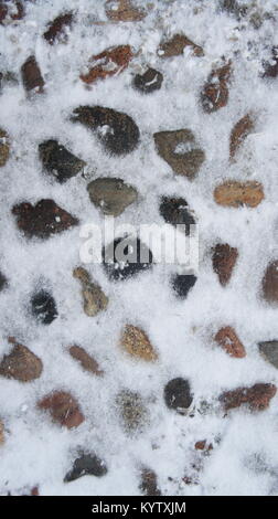 Old cobblestones covered with snow in winter, in Lodz Poland Stock Photo
