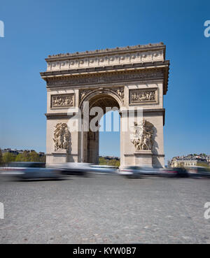 Arc de Triumph in Paris, France, text space. Long exposure to show movement of the cars on the roundabout. Stock Photo