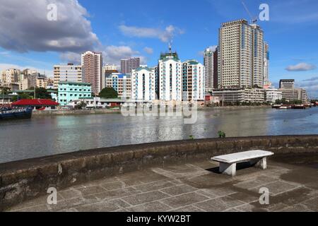 Manila city skyline in Philippines. Residential towers and Pasig River. Stock Photo