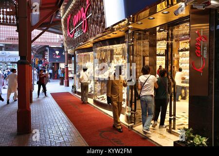 DUBAI, UAE - DECEMBER 10, 2017: People visit the Gold Souk in Dubai, UAE. The Gold Market has 300 retailers and is located in Al Dhagaya part of Deira Stock Photo