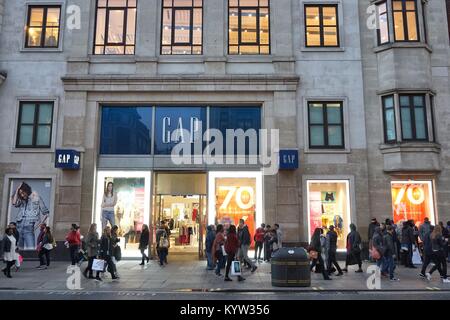 LONDON, UK - APRIL 23, 2016: People shop at The Gap, Oxford Street in London. Oxford Street has approximately half a million daily visitors and 320 st Stock Photo