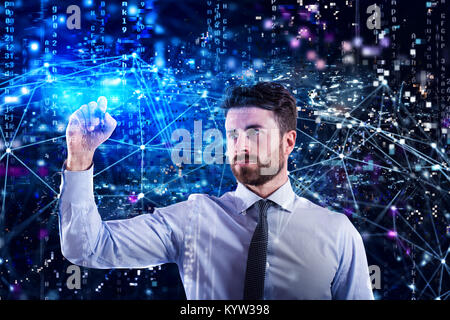 Programmer man works with a laptop on a network application Stock Photo