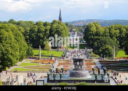 OSLO, NORWAY - AUGUST 2, 2015: People visit gardens and Vigeland Installation in Frogner Park, Oslo. 212 sculptures around the park were all designed  Stock Photo