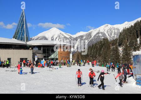 BAD HOFGASTEIN, AUSTRIA - MARCH 9, 2016: People visit Angertal ski station in Bad Hofgastein. It is part of Ski Amade, one of largest ski regions in E Stock Photo