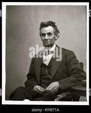 Abraham Lincoln, three-quarter length portrait, seated and holding his spectacles and a pencil Stock Photo