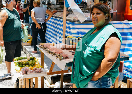 Afro-Brazilian woman selling sardines at a fish market in Nossa Senhora da Paz Square, Ipanema, Rio de Janeiro Stock Photo