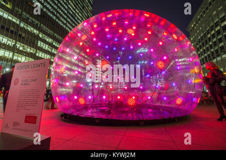 London, UK. 16th Jan, 2018. Winter Lights interactive art installations at Canary Wharf includes ‘Sonic Light Bubble' by Eness. A six-metre wide interactive bubble installation radiating light and sound when approached or touched, emitting a warm glow through 236 programmed LEDs constantly generating new visual patterns to a unique soundtrack. Credit: Guy Corbishley/Alamy Live News
