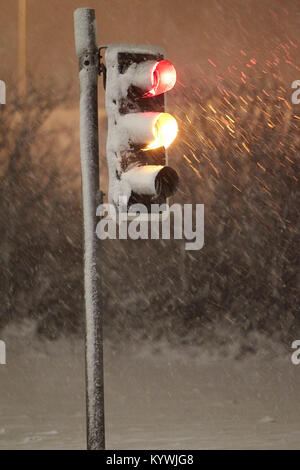 Newtownabbey, Northern, Ireland. 16th Jan, 2018. Traffic lights snowing up in Amber weather warning as heavy snowfall starts to cover Newtownabbey outside Belfast, Northern Ireland, 16th January 2018 Credit: Radharc Images/Alamy Live News Stock Photo