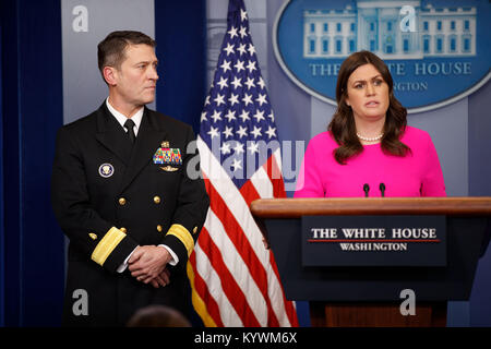 Washington, USA. 16th Jan, 2018. White House press secretary Sarah Huckabee Sanders (R) introduces White House physician, Navy doctor Ronny Jackson, during a press briefing at the White House in Washington, DC, the United States, on Jan. 16, 2018. U.S. President Donald Trump's overall health 'is excellent' and he did well on cognitive screening, the White House physician said on Tuesday. Credit: Ting Shen/Xinhua/Alamy Live News Stock Photo