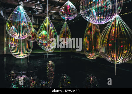 London, UK. 15th Jan, 2018. Winter Lights Festival in Canary Wharf 2018 - REFLECTING HOLONS, MICHIEL MARTENS & JETSKE VISSER - Experimenting with the ephemeral magic of light and movement, Jetske Visser and Michiel Martens call the mesmerising objects they stumbled upon by experimenting with reflecting materials HOLONS. Long strips of oil like transparent foil combined with simple spinning motors become a visual entity reflecting the lights around them as if they were water drops. Credit: Nunzio Prenna/Alamy Live News Stock Photo