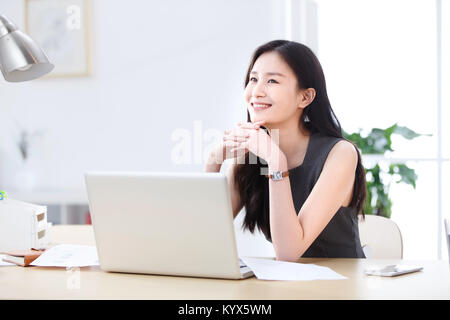A relaxed young business woman Stock Photo