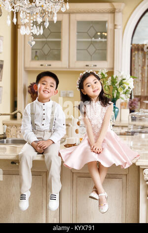 Boys and girls in dresses Stock Photo
