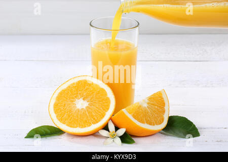Orange juice pouring pour bottle oranges fruit fruits drink Stock Photo