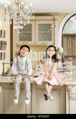 Boys and girls in dresses Stock Photo