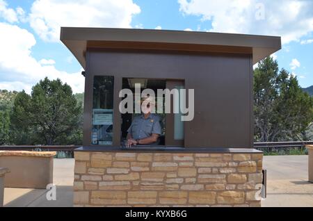 park ranger in the entrance booth to Mesa Verde National Park colorado USA Stock Photo