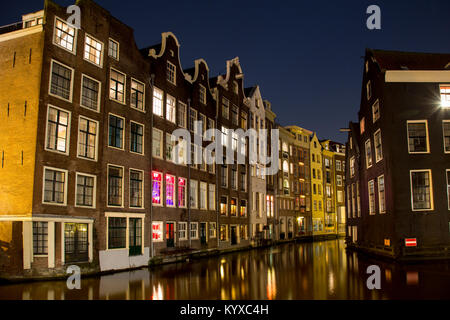 Amsterdam canal and houses at night with light reflection in the water just after sunset Stock Photo