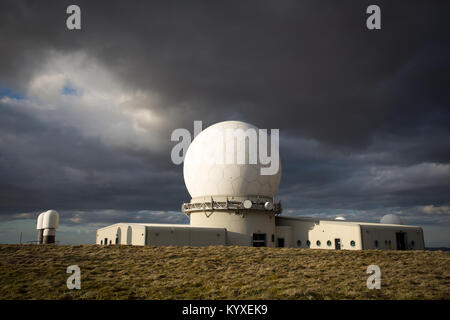 Storm clouds gather over the National Air Traffic Services Radar Control Centre at Great Dun Fell, Cumbria