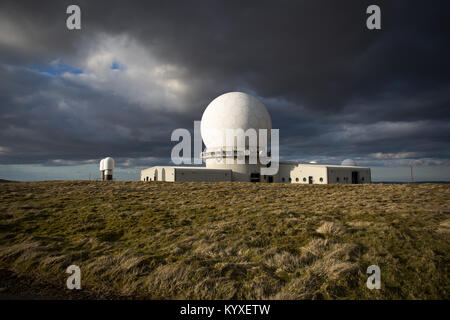 Storm clouds gather over the National Air Traffic Services Radar Control Centre at Great Dun Fell, Cumbria