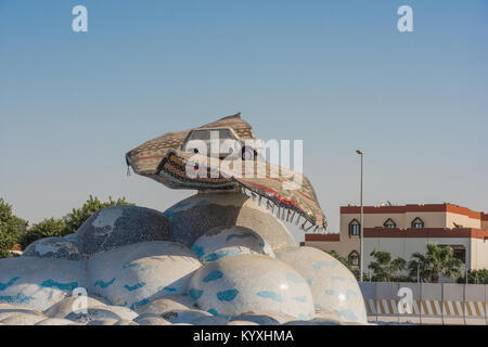 Car on carpet at a traffic roundabout in Jeddah, Saudi Arabia. Stock Photo