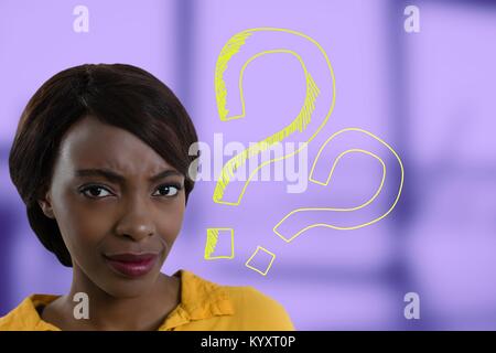 Confused woman frowning with question marks Stock Photo