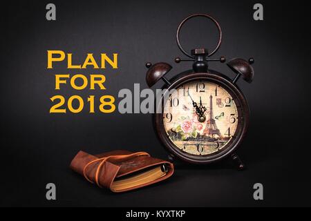 Close up of an old vintage watch with vintage planner, with the message Plans for 2018 Stock Photo