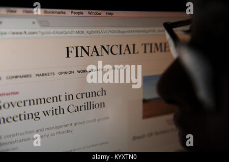 A woman looks at the Financial Times website Stock Photo