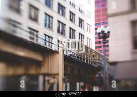 Low angle view of train moving on railway bridge in city Stock Photo