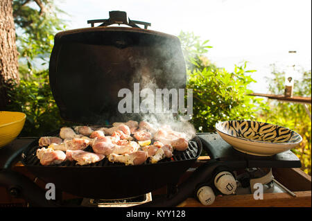 Close-up of meat being cooked on barbecue at yard Stock Photo