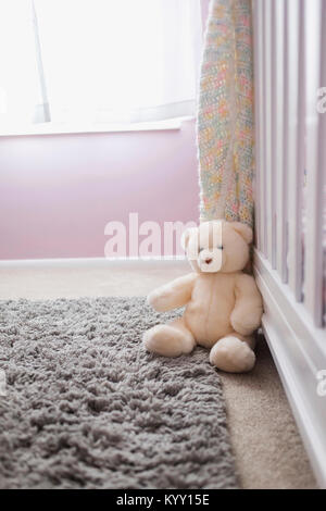 Teddy bear on carpet at home Stock Photo
