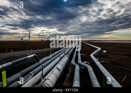High angle view of Trans-Alaskan Pipeline against cloudy sky during sunset Stock Photo
