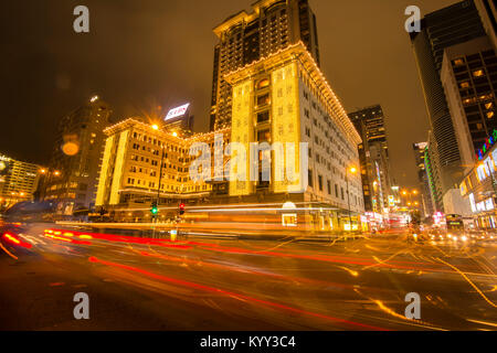 Light trail at Peninsula Hotel in Hong Kong famous junction for tourist Stock Photo