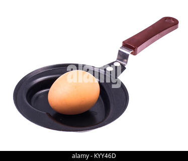Whole egg in the frying pan. Studio Photo Stock Photo