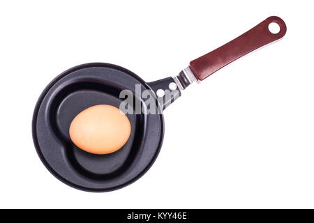 Whole egg in the frying pan. Studio Photo Stock Photo