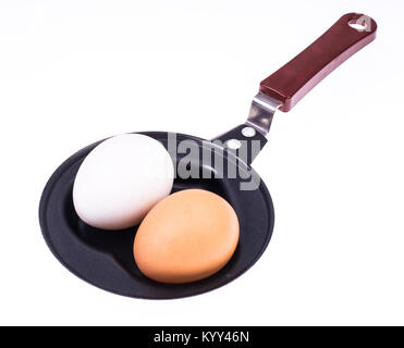 Whole egg in the frying pan. Studio Photo Stock Photo