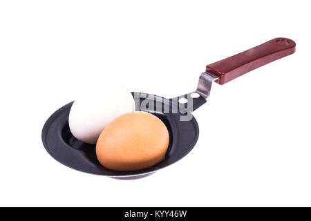 Whole egg in the frying pan. Studio Photo Stock Photo