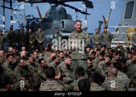 PACIFIC OCEAN (Jan. 12, 2018) –  Col. Joseph Clearfield, commanding officer of 15th Marine Expeditionary Unit, addresses Marines and Sailors of the 15th MEU aboard USS San Diego (LPD 22). The 15th Marine Expeditionary Unit and America Amphibious Ready Group are operating in the U.S. 7th Fleet area of operations to enhance regional partnerships and serve as a ready-response capability for any type of contingency. (U.S. Marine Corps Stock Photo