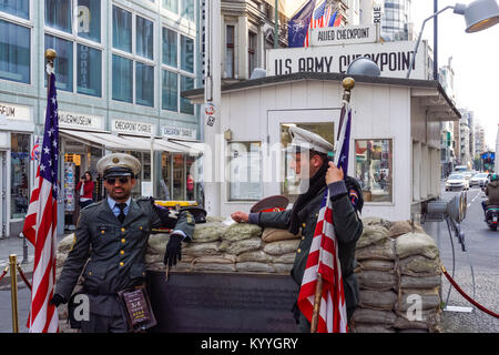 Men dressed as American soldiers at the Checkpoint Charlie in Berlin, Germany Stock Photo