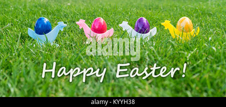 Eastercard with colorful Easter eggs in egg cups Stock Photo