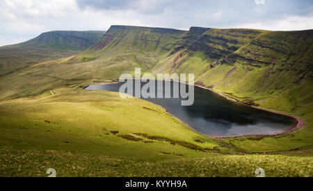 Glacial lake of Llyn y Fan Fach looking towards Picws Ddu and Fan Breicheniog in the Brecon Beacons national Park Wales UK Stock Photo
