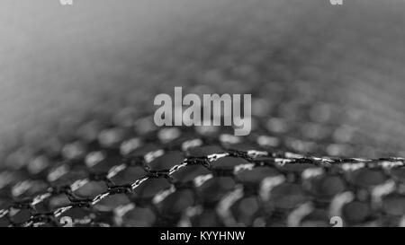 Abstract black and white texture from netting. Artistic detail of hexagonal grid with bokeh. Concept for science, research, technology and industry. Stock Photo
