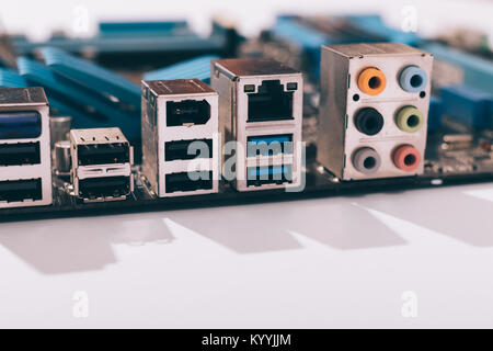 Close-up of motherboard connectors on white table Stock Photo