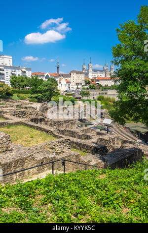 Ruins of Roman Theatre in Lyon, France with the Basilica of Notre-Dame de Fourviere in the background. Stock Photo